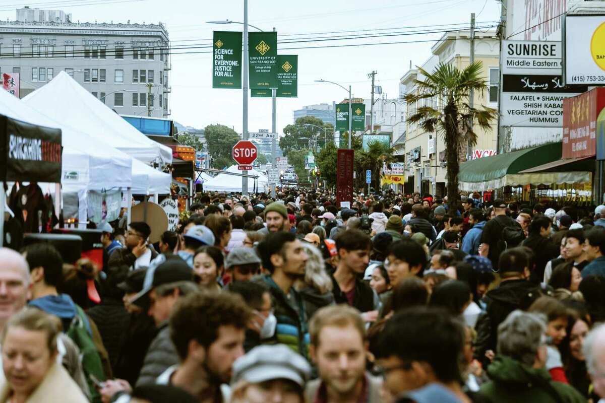 A large crowd moves through the Night Market in the Sunset District Friday. San Francisco Supervisor Joel Engardio is launching the Sunset District’s first-ever night market to foster community, stimulate the local economy, and bring a sense of joy to the city.
