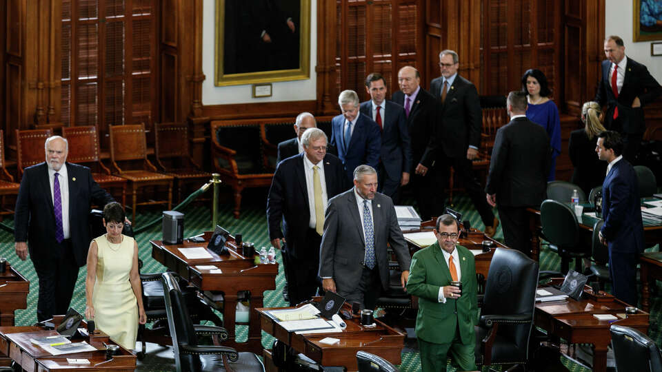 Senators walk into the Senate Chamber to vote on the 16 articles of impeachment on day 10 of suspended Texas Attorney General Ken Paxton's impeachment trial at the Texas Capitol on Saturday, Sept. 16, 2023, in Austin, Texas.