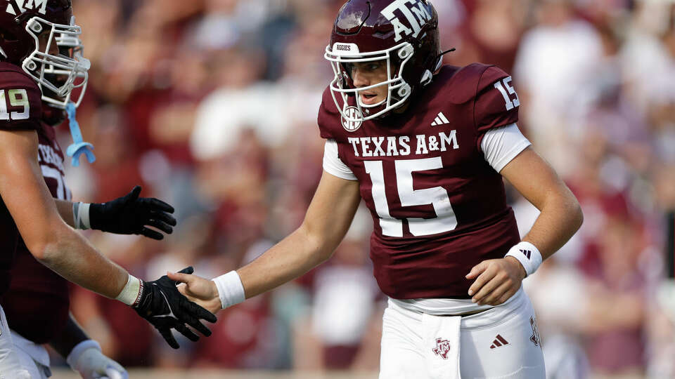 COLLEGE STATION, TEXAS - SEPTEMBER 16: Conner Weigman #15 of the Texas A&M Aggies celebrates rushing for a touchdown against the Louisiana Monroe Warhawks during the first half at Kyle Field on September 16, 2023 in College Station, Texas. (Photo by Carmen Mandato/Getty Images)