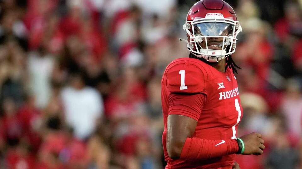 Houston Cougars quarterback Donovan Smith (1) looks back at the video board during the first quarter of the University of Houston's inaugural Big 12 NCAA college football game at TDECU Stadium, Saturday, Sept. 16, 2023, in Houston.