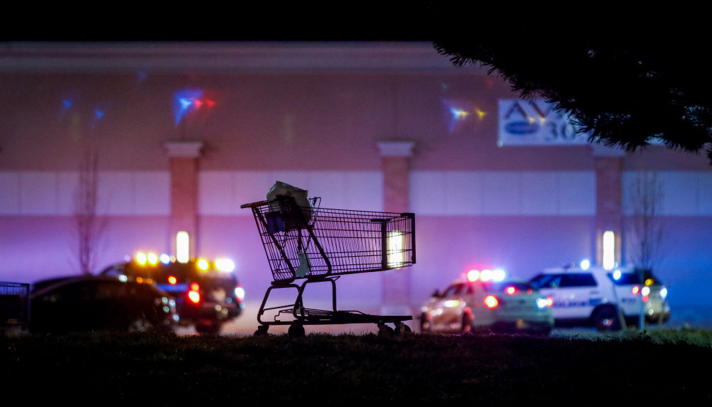 Murder suspect hospitalized after police chase outside Walmart