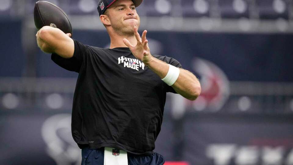 Houston Texans quarterback Davis Mills throws a football while warming up before an NFL football game against the Indianapolis Colts Sunday, Sept. 17, 2023, in Houston.