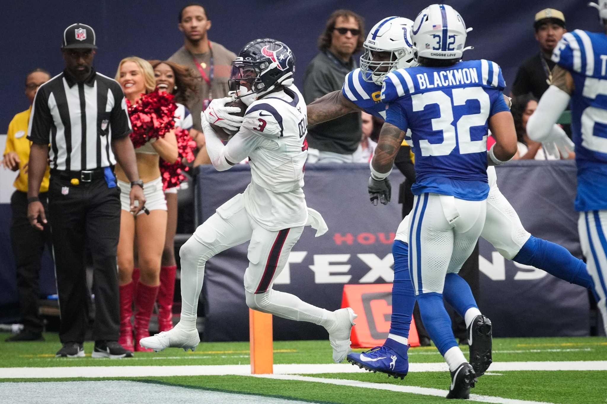 Houston Texans wide receiver Tank Dell runs after a catch against