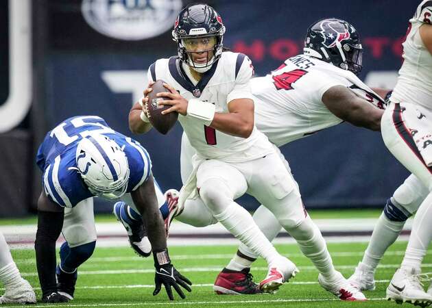 Houston Texans quarterback C.J. Stroud (7) scrambles out of the pocket past Indianapolis Colts defensive end Kwity Paye (51) during the second half an NFL football game Sunday, Sept. 17, 2023, in Houston.