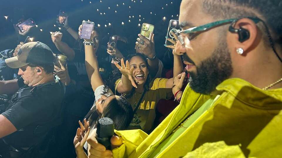 Drake walks through the crowd and interacts with fans at Toyota Center, Sept. 17, 2023.