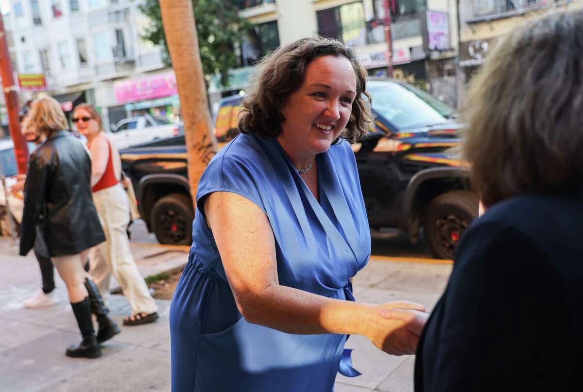 Rep. Katie Porter, left, seen greeting people in San Francisco’s Mission District on Aug. 29, has derided earmarks as a “fancy Washington term that means funding for politicians’ pet projects.”