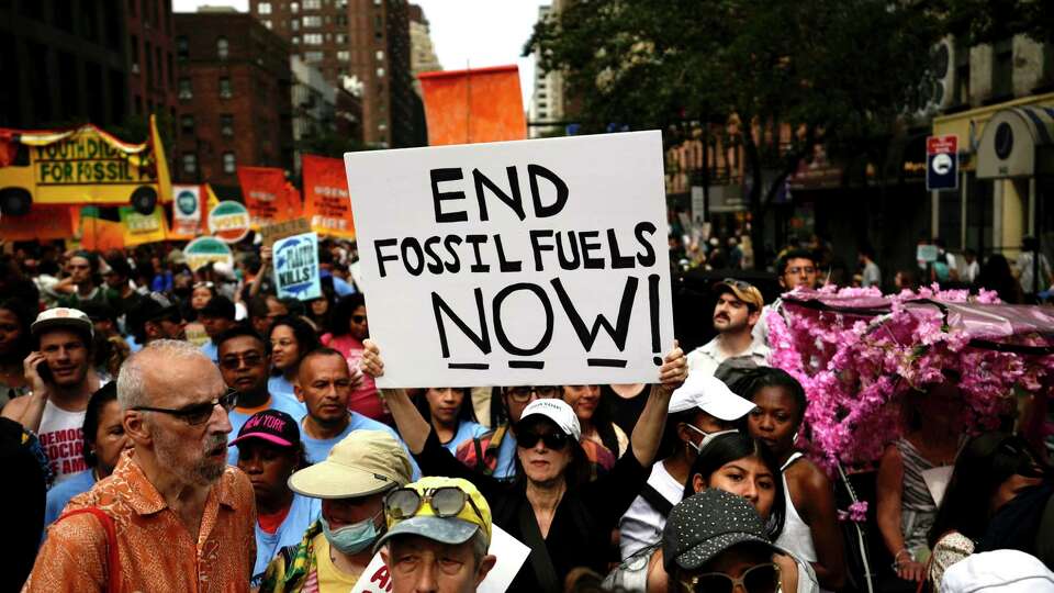 Climate activists attend a rally to end fossil fuels, in New York, Sunday, Sept. 17, 2023. (AP Photo/Bryan Woolston)