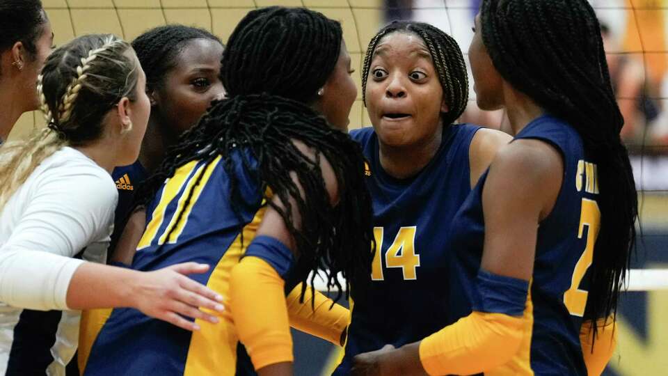 Cypress Ranch setter Zora Bello (14) reacts after scoring a point in the first set of a District 16-6A high school volleyball match at Cypress Ranch High School, Tuesday, Sept. 19, 2023, in Cypress.