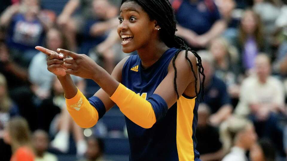 Cypress Ranch setter Zora Bello (14) reacts after a point in the second set of a District 16-6A high school volleyball match at Cypress Ranch High School, Tuesday, Sept. 19, 2023, in Cypress.