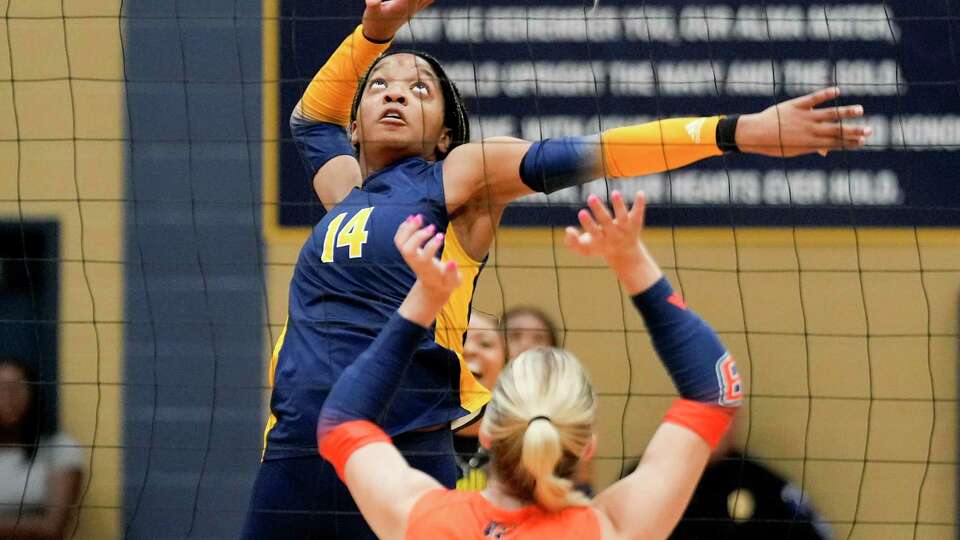 Cypress Ranch setter Zora Bello (14) prepares to take a shot against Bridgeland outside hitter Raylee Schaffner (3) in the second set of a District 16-6A high school volleyball match at Cypress Ranch High School, Tuesday, Sept. 19, 2023, in Cypress.