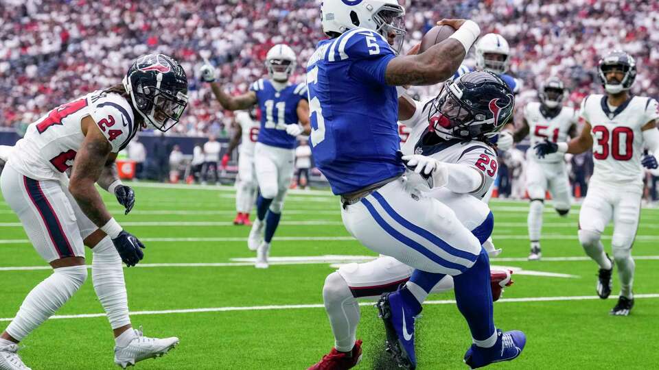 Indianapolis Colts quarterback Anthony Richardson (5) flies into the end zone as he is hit by Houston Texans safety M.J. Stewart (29) for a 15-yard touchdown run during the first half an NFL football game Sunday, Sept. 17, 2023, in Houston.