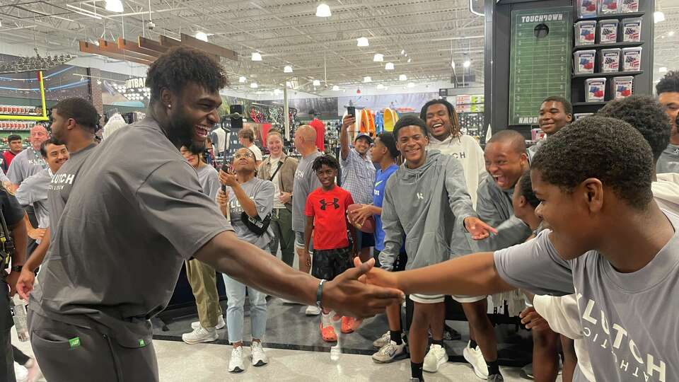 Texans star Will Anderson Jr. greets the Royal ISD football team at DICK's House of Sport on Tuesday, Sept. 20, 2023, in Katy.