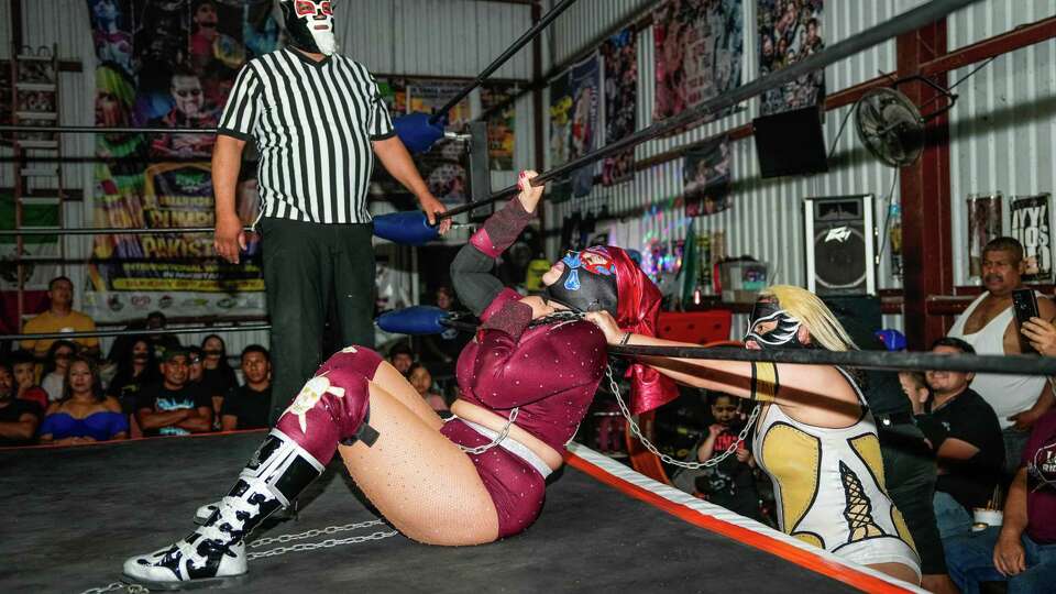 Luchadoras wrestle during a Lucha Libre fight at Coliseo Houston on Sunday, Sept. 17, 2023, in Houston.