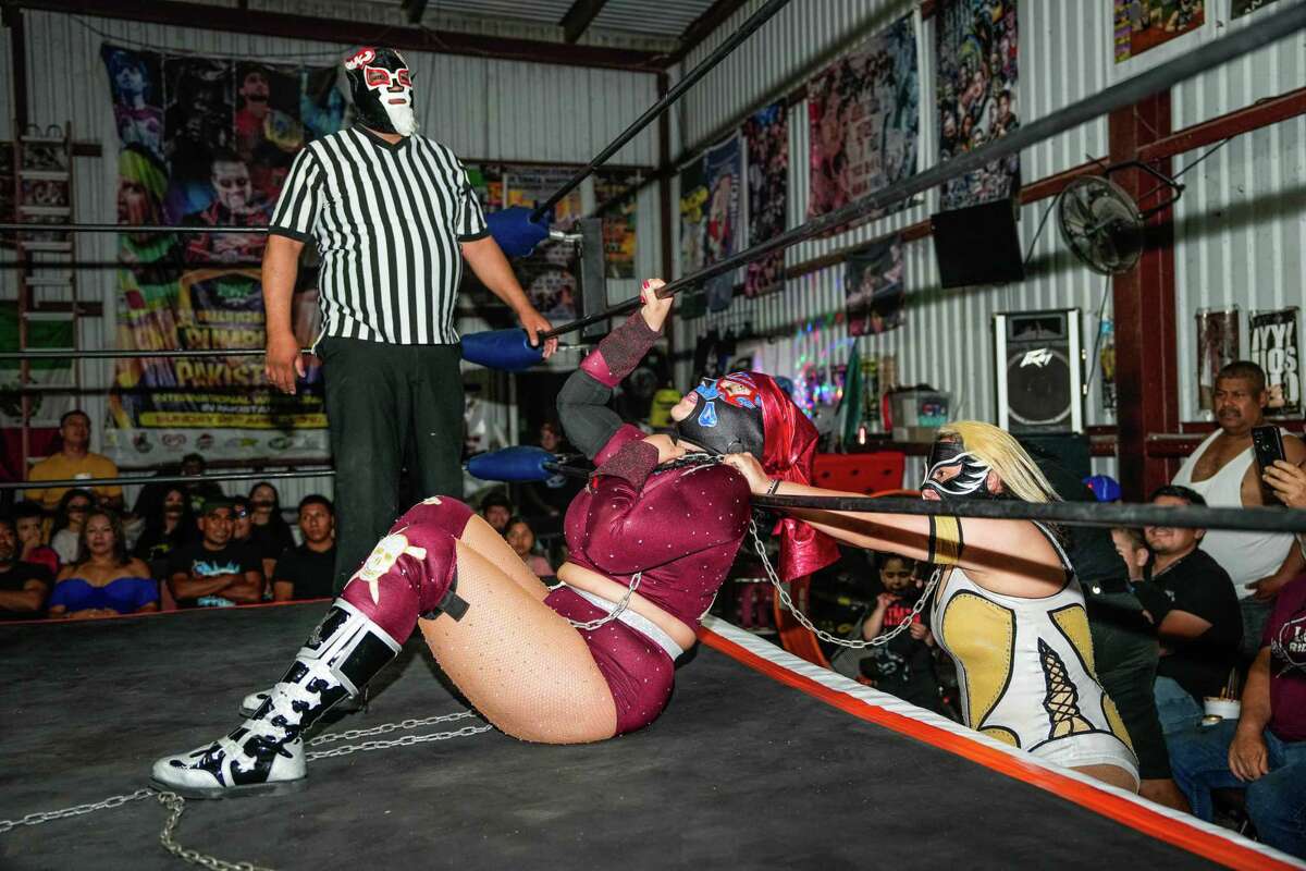 Luchadoras wrestle during a Lucha Libre fight at Coliseo Houston on Sunday, Sept. 17, 2023, in Houston.