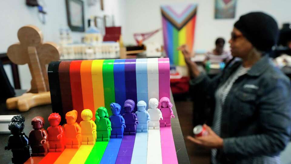 A rainbow Lego piece is shown on the shelves during a session of Lunch Church at Noon in the Canterbury Room for a Bible study meeting Wednesday, Sept. 20, 2023 in Houston. Several LGBTQ-affirming religious leaders at University of Houston continue to serve students in a hope to fill the gap left by the closure of the campus LGBTQ Resource Center.