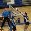 Gladwin's Ava Gary (right) gets a block at the net during Wednesday's match against Meridian, Sept. 20, 2023.
