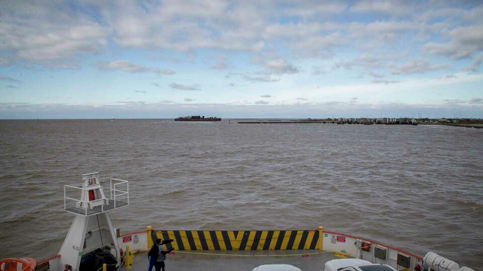 People ride the ferry to the Bolivar Peninsula, Friday, Dec. 14, 2018, in Galveston.