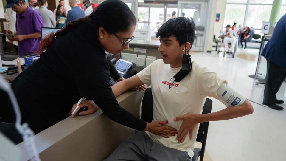 Registered nurse Leena E. checks Edgar Melo, 16, of Houston in the emergency room at Harris Health Lyndon B. Johnson General Hospital in Houston, TX on September 15, 2023.