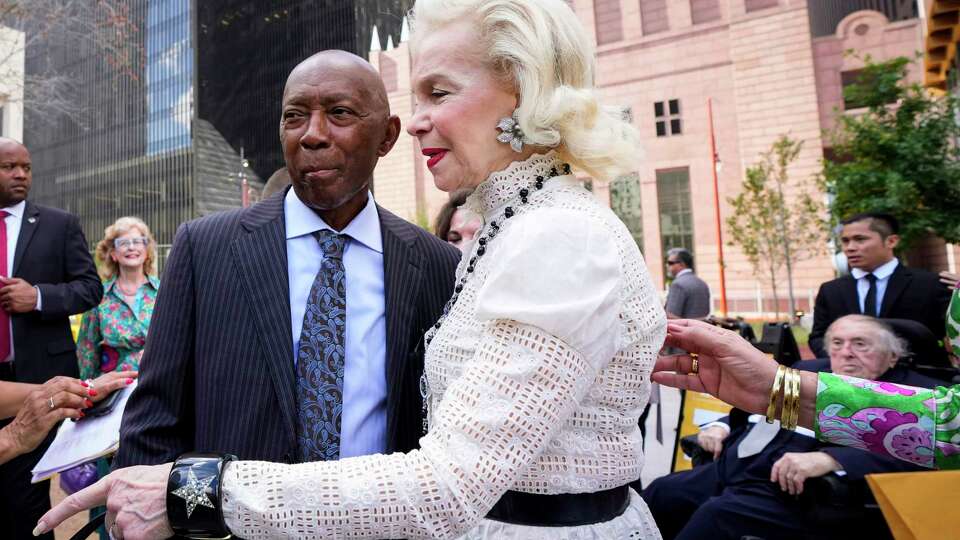Mayor Sylvester Turner, left, greets Lynn Wyatt as they arrive for the grand opening ceremony of Lynn Wyatt Square for the Performing Arts Thursday, Sept. 21, 2023 in Houston. Wyatt Square replaces what had long been Jones Plaza at the intersection of Texas and Louisiana. The green 1.5-acres space includes a flexible performance lawn for concerts and other free programs, a cascading water feature, accessible entries, gardens, trees, a street theater, one-of-a-kind tête-à-tête rockers/seating, lighting and sound elements. Mini murals cover traffic boxes within the square. In addition, park visitors will enjoy complimentary programming that reflects the cultural district and Houston's dynamic and diverse population. Wyatt donated $10 million to revitalize the space.