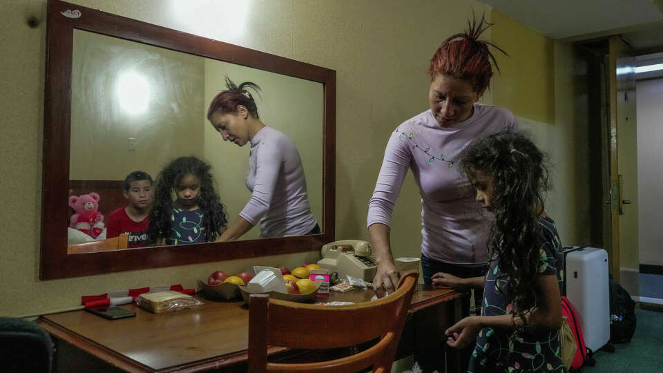 After spending three days in the hospital with her husband after he suffered a heart attack, Dailiris Valera returns to the motel turned make shift shelter, run by DHS, just outside of JFK airport where her children Alejandro, 12 and Sofia, 7 wait on her and on the fate of their father on Wednesday, June 14, 2023 in New York .