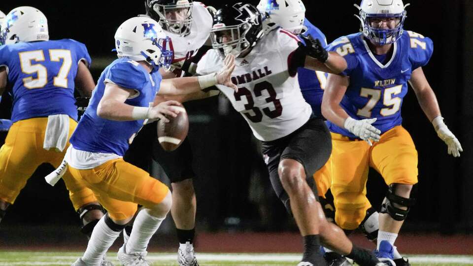 Tomball defensive lineman Ramon Pernas (33) sacks Klein quarterback Bankston Lembcke (3) during the third quarter of a District 15-6A high school football game at Klein Memorial Stadium, Thursday, Sept. 21, 2023, in Spring.