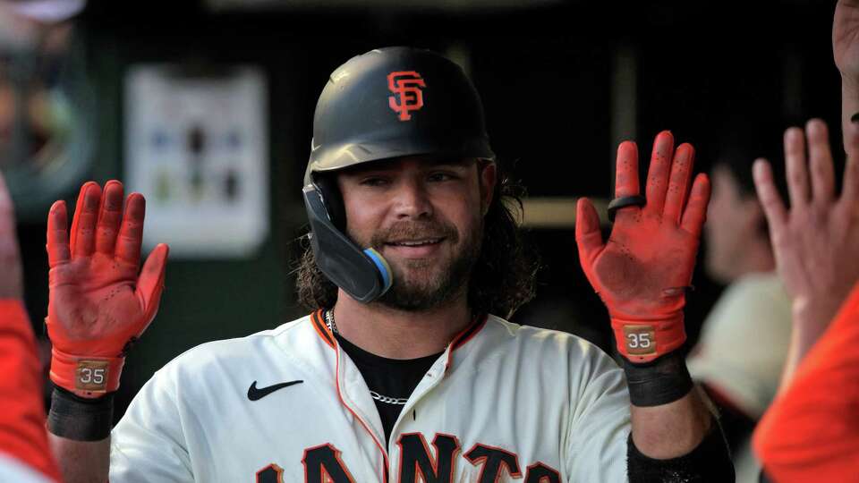 Isan Diaz of the San Francisco Giants looks on from the dugout