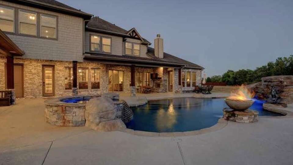 This $1.6 million home in Pearland at 2260 Stevens Drive has 6 bedrooms, 5 full and 1 half bath, a large pool and a wheelchair accessible guest room on the first floor.