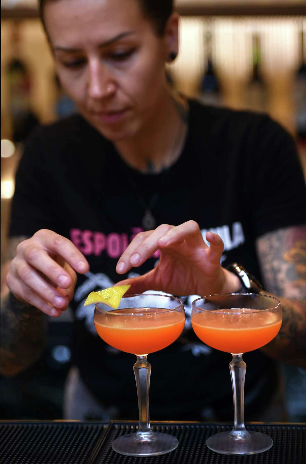 Beverage Director Michela Zurstadt adds a lemon peel to a Red Eye Redemption at Gioia in New Haven on September 21, 2023.