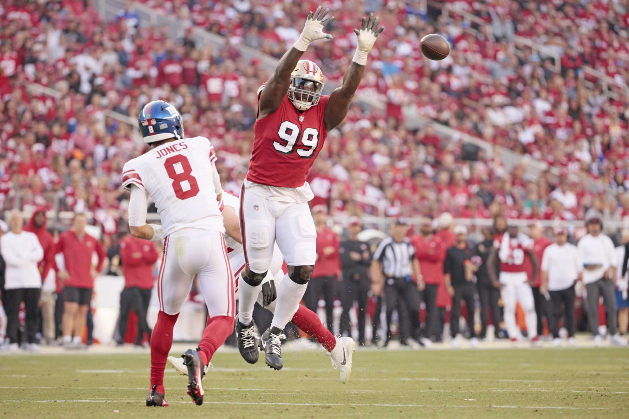 San Francisco 49ers defensive tackle Kevin Givens, left, performs