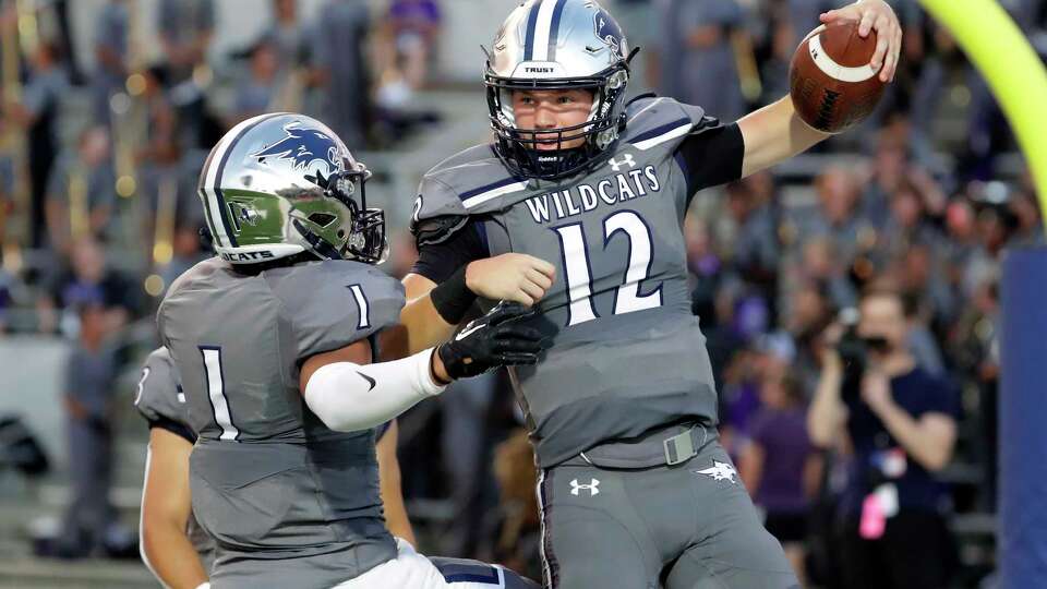 Tomball MemorialÕs Yeriel Rodriguez (1) and Lane Stockton (12) celebrate the touchdown by Stockton during the first half of their District 15-6A high school football game against Klein Cain held at Tomball ISD Stadium Friday, Sept. 22, 2023 in Tomball, TX.