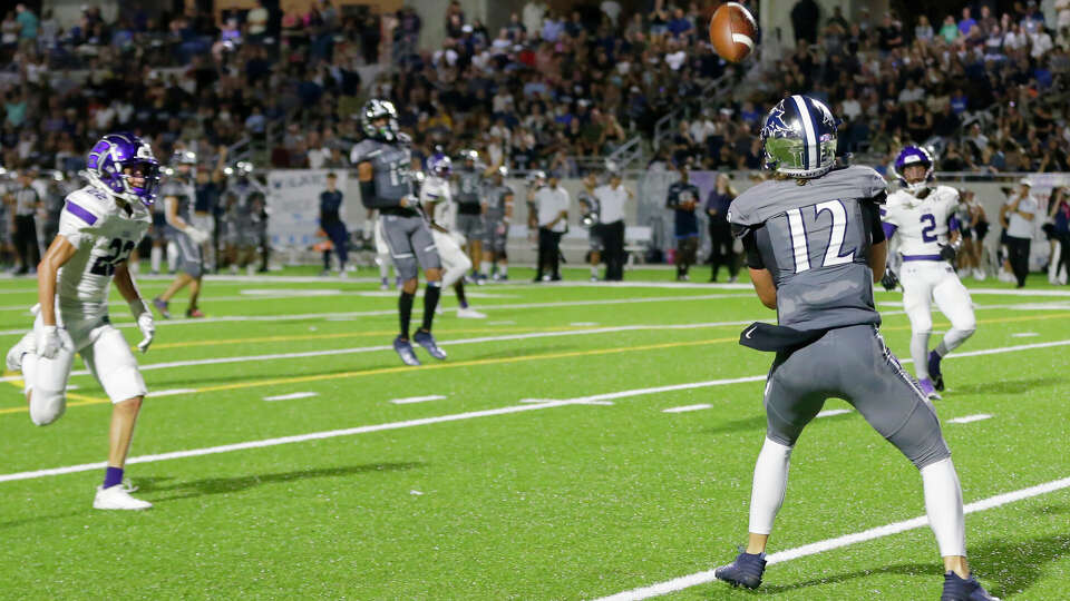 Tomball Memorial receiver Lane Stockton (12) makes the reception in the end zone to score against Klein Cain during the first half of their District 15-6A high school football game held at Tomball ISD Stadium Friday, Sept. 22, 2023 in Tomball, TX.