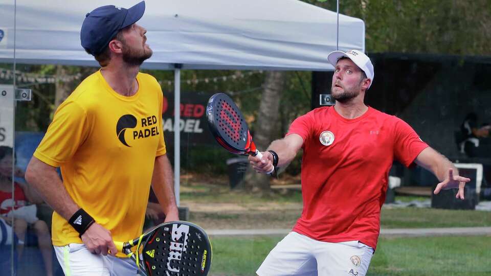 I. Arizpe and A.N. Soza versus O. Almada and J. Arganaras during a doubles match of Padel Tennis, a racket sport of Mexican origin, held at The Woodlands Padel Friday, Sept. 22, 2023 in Spring, TX. Although Padel shares the same scoring system as tennis, the rules, strokes, and technique are different, including a glass wall at the back of each end of the court allowing players to makes plays off the walls.