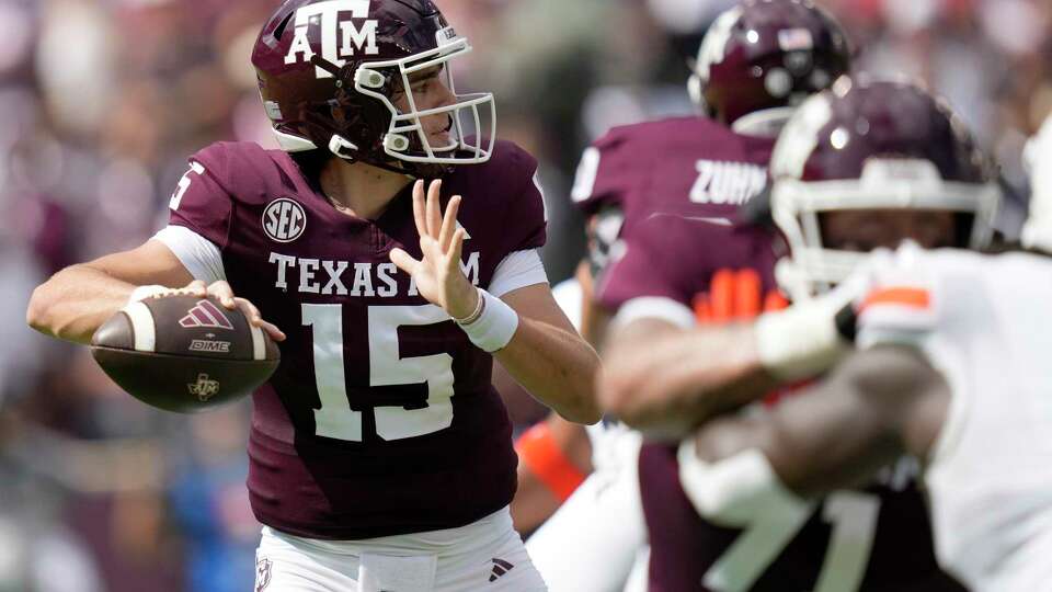 Texas A&M quarterback Conner Weigman (15) throws down field against Auburn during the first quarter of an NCAA college football game Saturday, Sept. 23, 2023, in College Station, Texas. (AP Photo/Sam Craft)