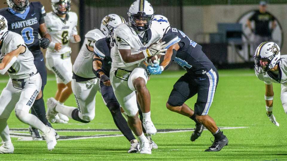 Jordan's Chad Gasper (2) fights for yardage through the Paetow defense in the first half of a high school football game at Legacy Stadium, Saturday, Sep. 23, 2023 in Katy.