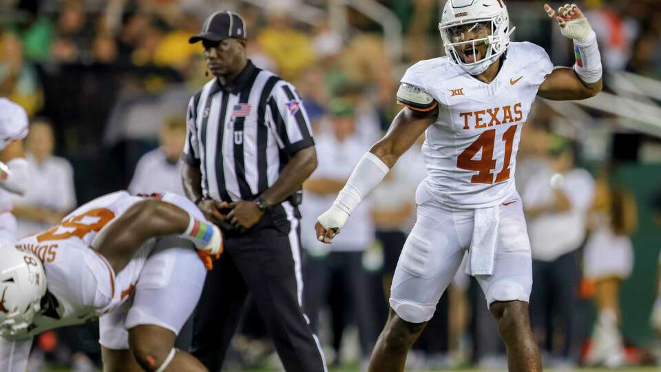 Texas linebacker Jaylan Ford (41) instructs his team during the second half of an NCAA college football game against Baylor, Saturday, Sept. 23, 2023, in Waco, Texas. (AP Photo/Gareth Patterson)