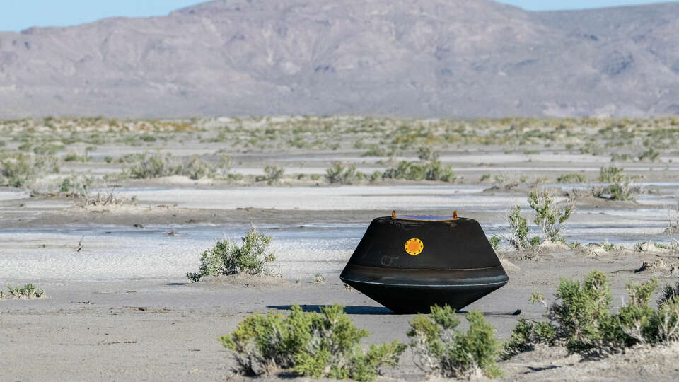 The sample return capsule from NASA's OSIRIS-REx mission is seen shortly after touching down in the desert, Sunday, Sept. 24, 2023, at the Department of Defense's Utah Test and Training Range. The sample was collected from the asteroid Bennu in October 2020 by NASA's OSIRIS-REx spacecraft. Photo Credit: (NASA/Keegan Barber)