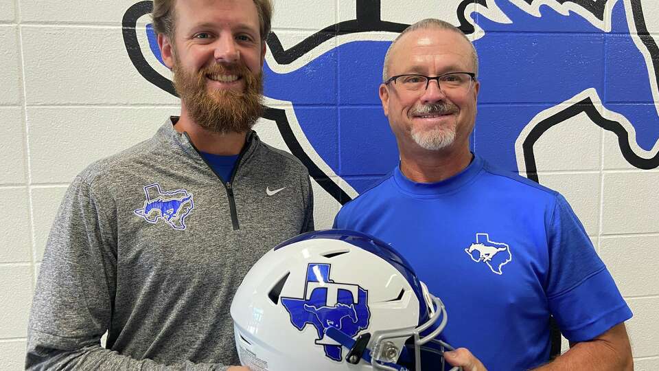 After playing for dad in high school, Austin Simmons, left, is enjoying coaching on Chad Simmons' staff at Katy Taylor. 