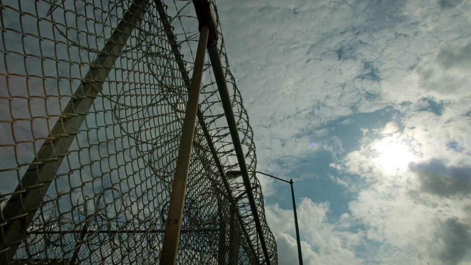 Razor wire on a fence at the Stringfellow Unit near Rosharon. Wednesday, Sept. 24, 2008. ( Steve Ueckert / Chronicle )