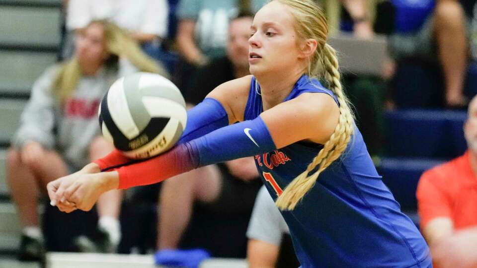 Grand Oaks setter Samantha Sampson (1) returns a hit during the first set of a District 13-6A high school volleyball match at College Park High School, Tuesday, Sept. 26, 2023, in The Woodlands.