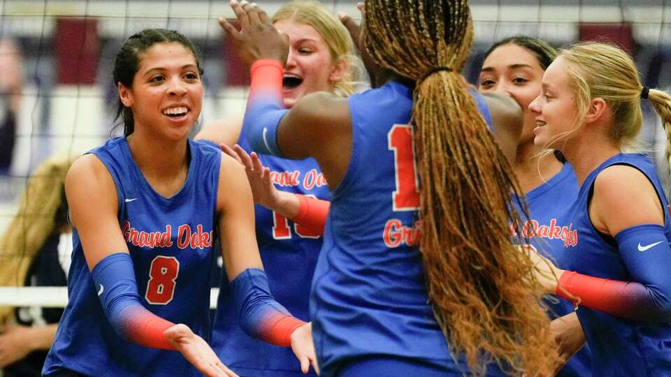 Grand Oaks outside hitter Halle Thompson (8) reacts after scoring a point during the second set of a District 13-6A high school volleyball match at College Park High School, Tuesday, Sept. 26, 2023, in The Woodlands.