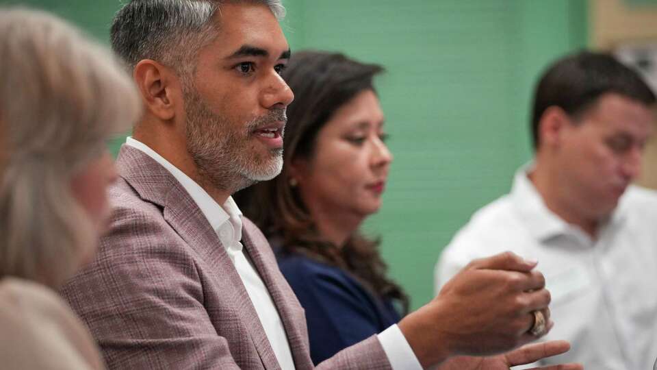 Mario Castillo, a city council candidate, talks to residents during a District H candidate forum Tuesday, Sept. 26, 2023, at the Proctor Plaza Park Community Center in Houston.
