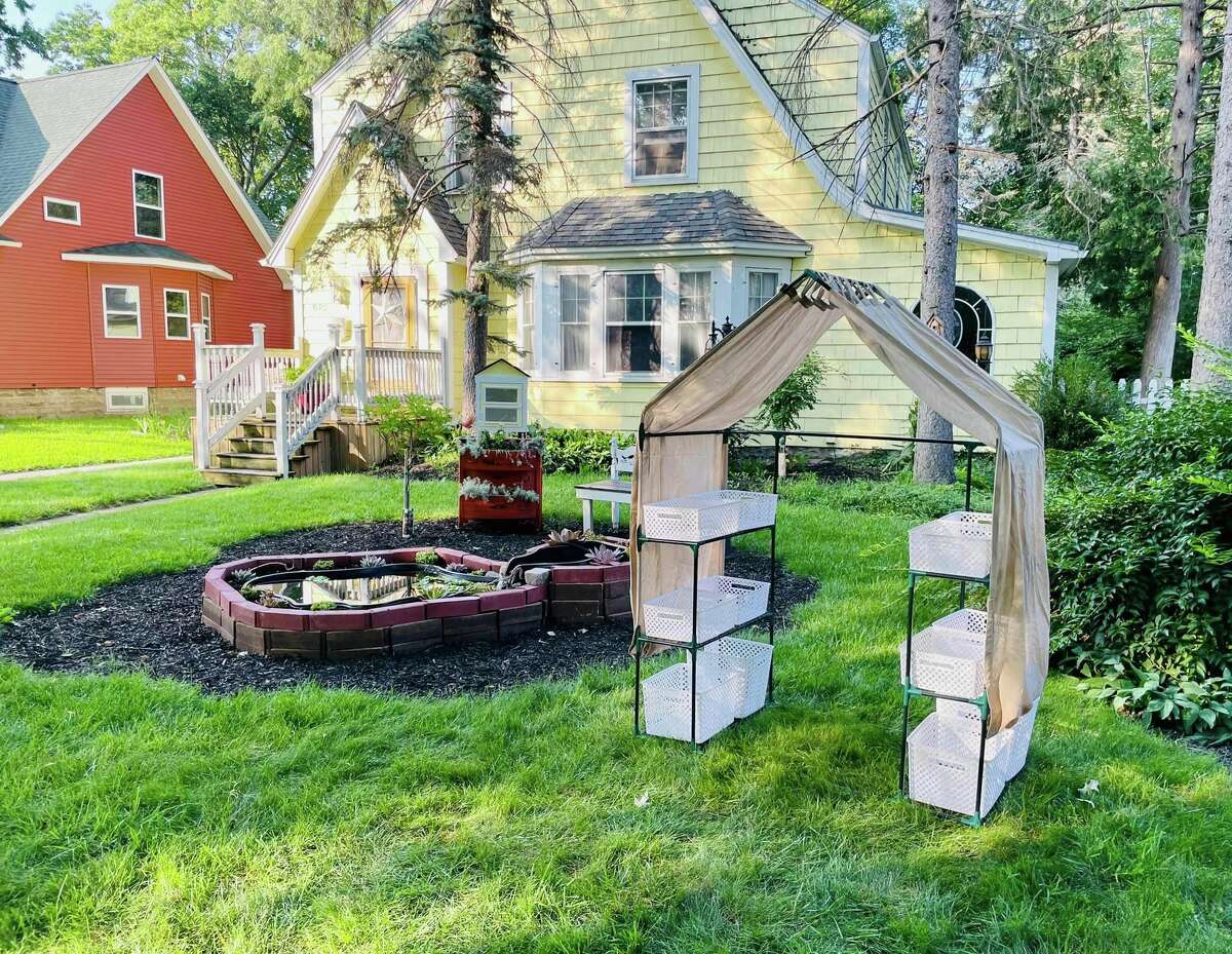 In order for his people to have a place to visit with Nick, and in an effort to keep him a little closer to home, an elaborate fish pond and a bench for king kitty and his visitors were installed in Holly Booth's front yard.  
