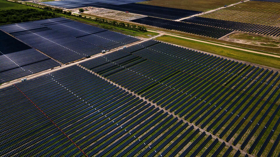 Solar panels fill fields, Tuesday, May 11, 2021, at a large solar farm south of El Campo.