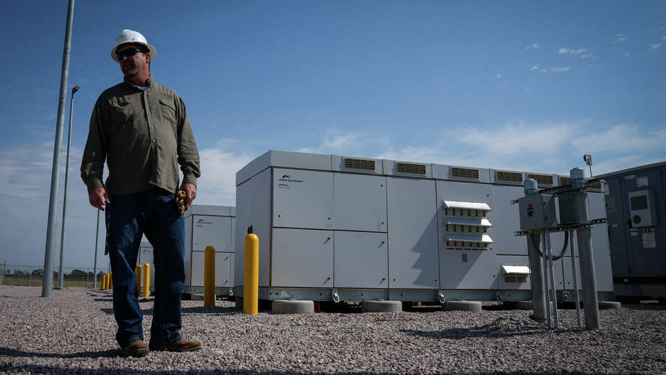 Danny Lynch, site manager, walks through a battery storage yard Tuesday, Sept. 12, 2023, at the Blue Jay solar and storage plant in Iola.