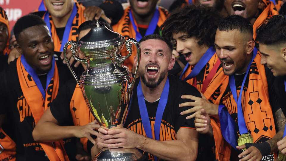 FORT LAUDERDALE, FLORIDA - SEPTEMBER 27: Héctor Herrera #16 of Houston Dynamo raises the Lamar Hunt Cup after winning the 2023 U.S. Open Cup Final against the Inter Miami at DRV PNK Stadium on September 27, 2023 in Fort Lauderdale, Florida.