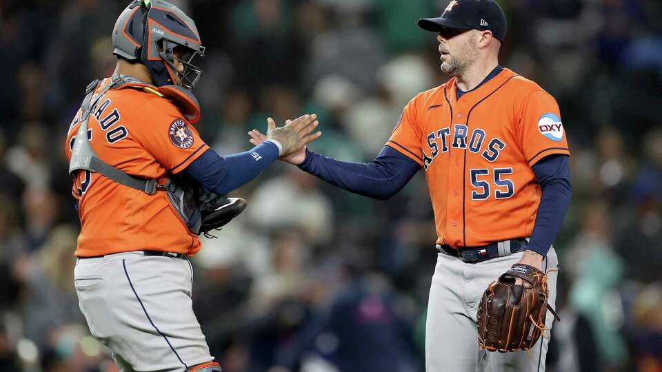 SEATTLE, WASHINGTON - SEPTEMBER 27: Martin Maldonado #15 and Ryan Pressly #55 of the Houston Astros celebrate their 8-3 win against the Seattle Mariners at T-Mobile Park on September 27, 2023 in Seattle, Washington.