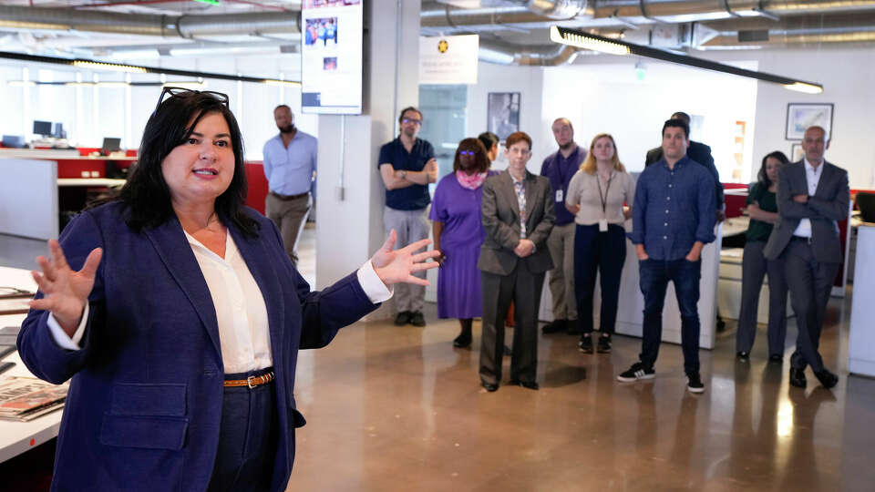 New Houston Chronicle Executive Editor Kelly Ann Scott speaks to the newsroom staff after her hiring was announced on Thursday, Sept. 28, 2023, in the Chronicle newsroom in Houston. Scott joins the Chronicle from Alabama Media Group, part of Advance Local, where she served as editor-in-chief and vice president of content, leading an editorial team of more than 120 people. There, she oversaw the state's largest digital news site AL.com; startup brand Reckon; the solutions-focused Alabama Education Lab; a daily, subscriber e-edition The Lede; and more. She also previously held senior editorial leadership positions at Gannett.