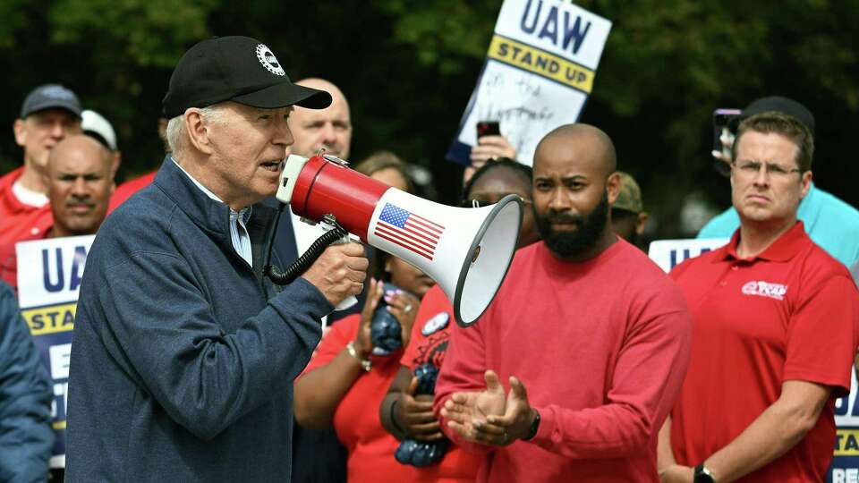 President Joe Biden addresses a UAW picket line at a General Motors Service Parts Operations plant in Belleville, Michigan, on Sept. 26, 2023.