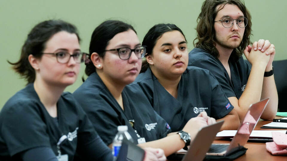 First-semester nursing student Oleksandr Bulat, left, listens along fellow first-year students to instructions about immunization procedures at Lone Star College - North Harris, Thursday, Sept. 28, 2023, in Houston. Bulat was one of two men in the 20-person class. Lone Star's overall enrollment is 58 percent female which follows a trend in high-education enrollment nationally.