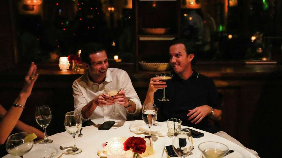 Guests Andrew Montgomery, 25, and Marshall Wood, 25, during 'Armandos' restaurant's weekly Thursday night transformation into a dance club on Thursday, Sept. 28, 2023, in Houston.